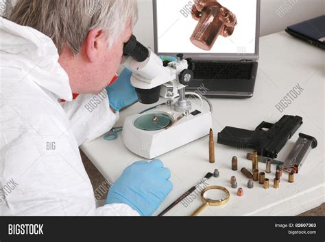 orensic scientists analyze pieces of evidence in a laboratory|forensic lab identification.